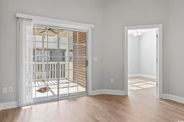 doorway featuring light hardwood / wood-style floors and ceiling fan