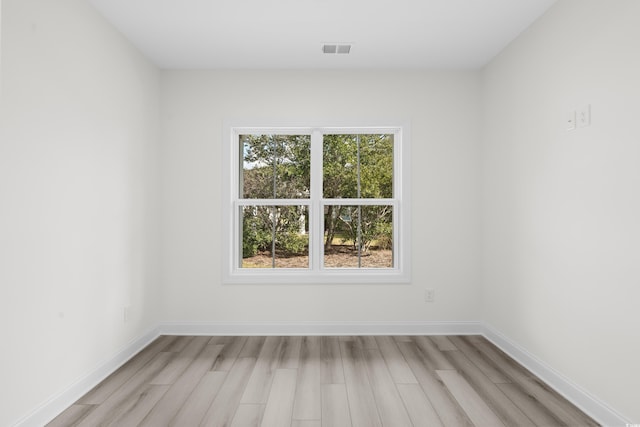 unfurnished room featuring light hardwood / wood-style flooring