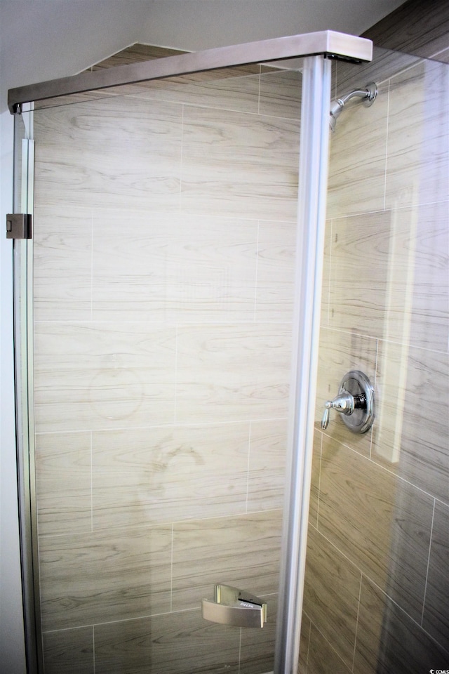 full bath featuring a shower stall