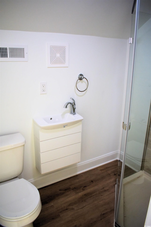 37 Geney Ln, Pawleys Island, SC 29585 - bathroom with a sink, toilet, a shower stall, wood finished floors, and visible vents