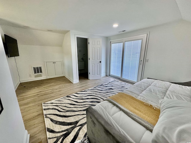 37 Geney Ln, Pawleys Island, SC 29585 - bedroom with visible vents, baseboards, wood finished floors, and vaulted ceiling