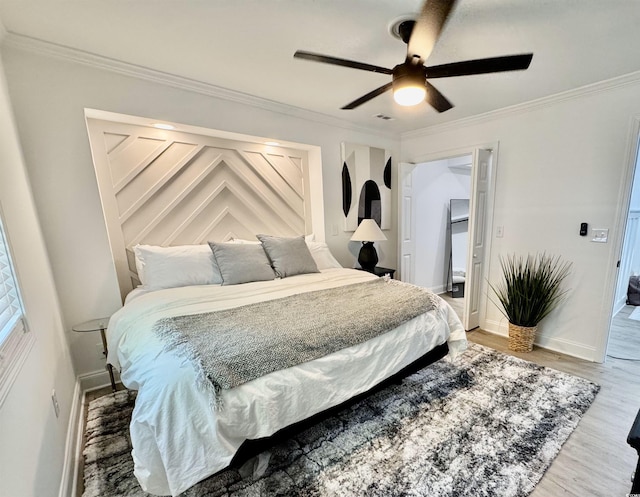 37 Geney Ln, Pawleys Island, SC 29585 - bedroom featuring baseboards, ornamental molding, ceiling fan, and wood finished floors