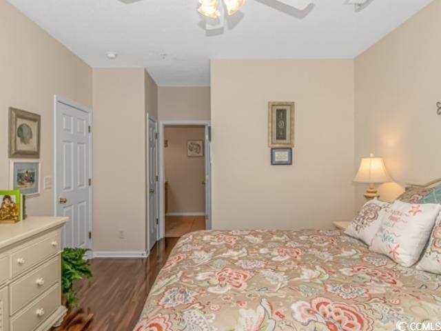 bedroom featuring dark wood-type flooring and ceiling fan