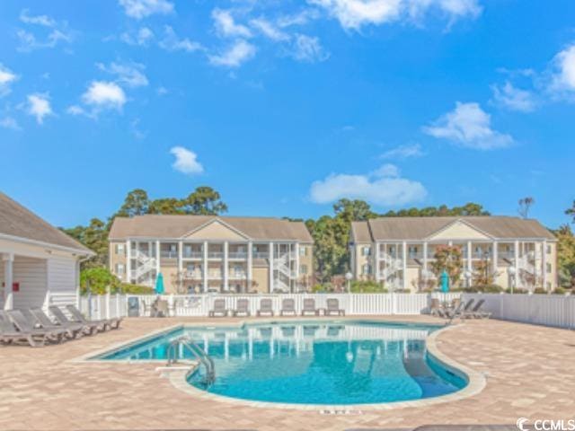 view of swimming pool featuring a patio