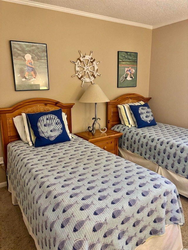 bedroom featuring carpet, crown molding, and a textured ceiling