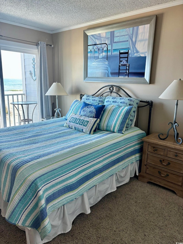 carpeted bedroom with crown molding, a textured ceiling, and a water view