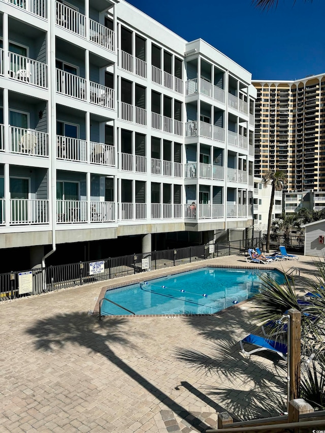 view of pool featuring a patio area