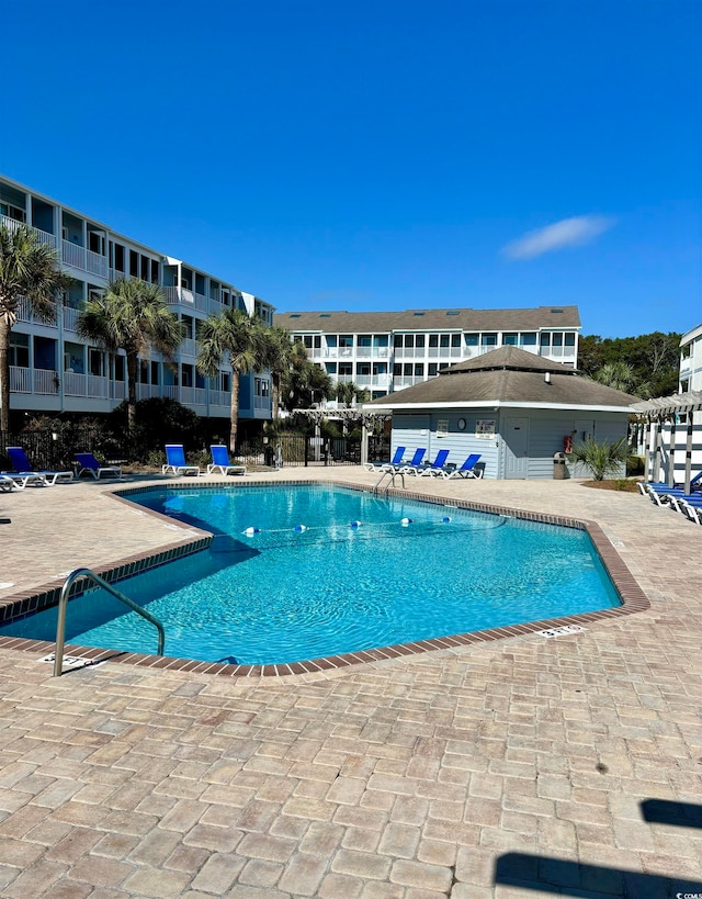 view of pool featuring a patio area