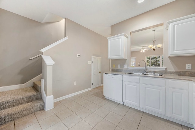 kitchen featuring light tile patterned flooring, sink, white dishwasher, white cabinetry, and decorative light fixtures