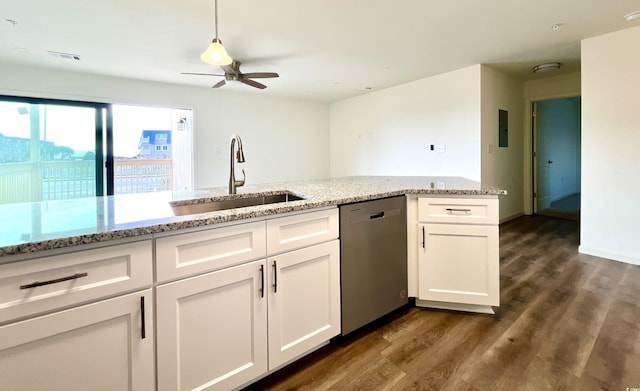 kitchen with sink, dark hardwood / wood-style flooring, stainless steel dishwasher, white cabinets, and light stone counters