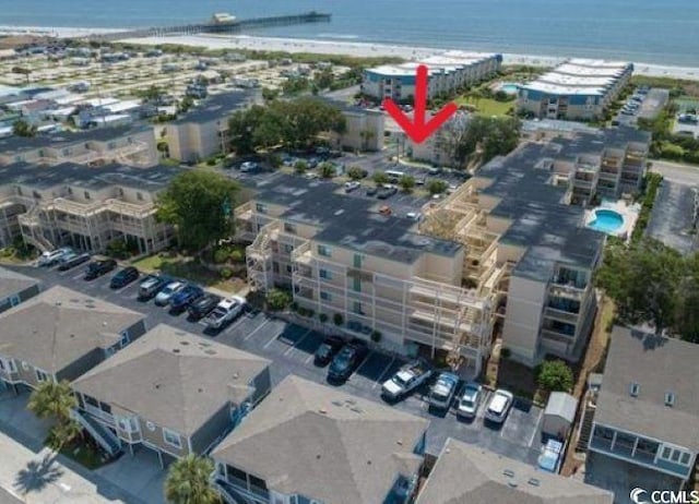 aerial view of property's location featuring a nearby body of water