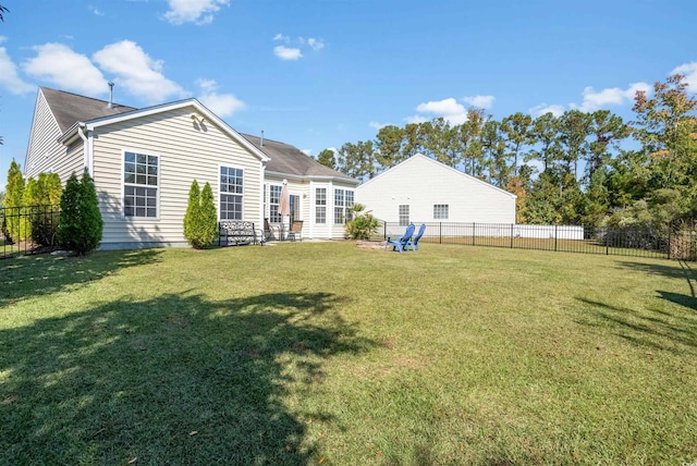 rear view of property featuring a patio and a lawn