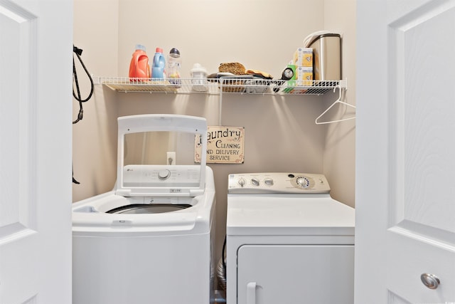 laundry area with washing machine and clothes dryer