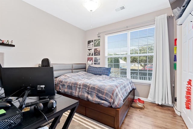 bedroom with light hardwood / wood-style flooring