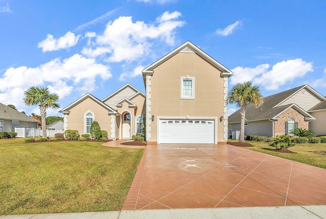 view of property featuring a garage and a front lawn