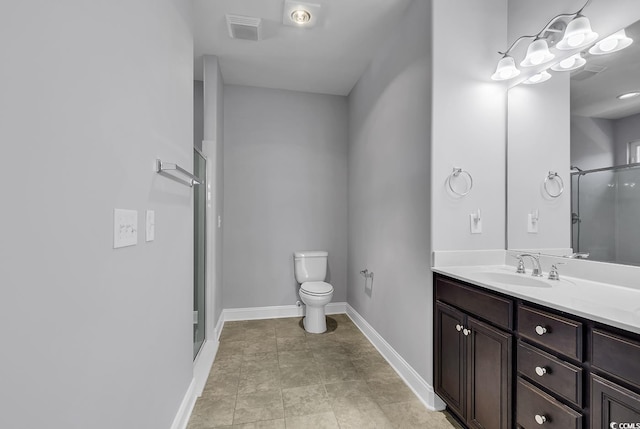 full bath featuring a shower stall, toilet, vanity, and baseboards