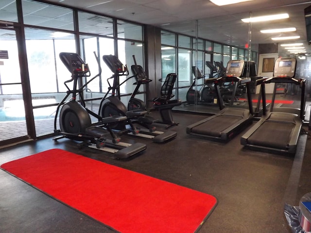 exercise room featuring expansive windows