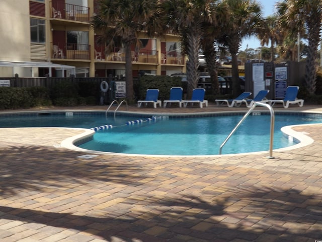 view of swimming pool with a patio area