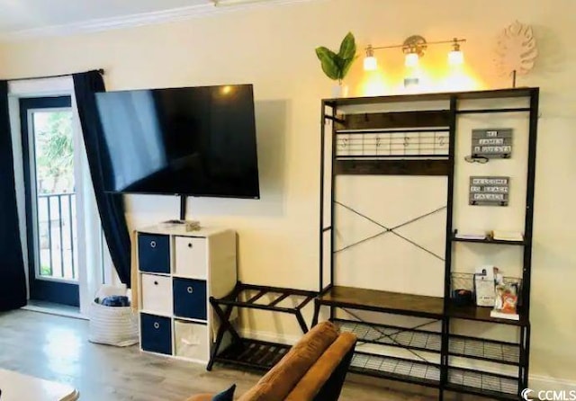 bedroom featuring crown molding and hardwood / wood-style floors