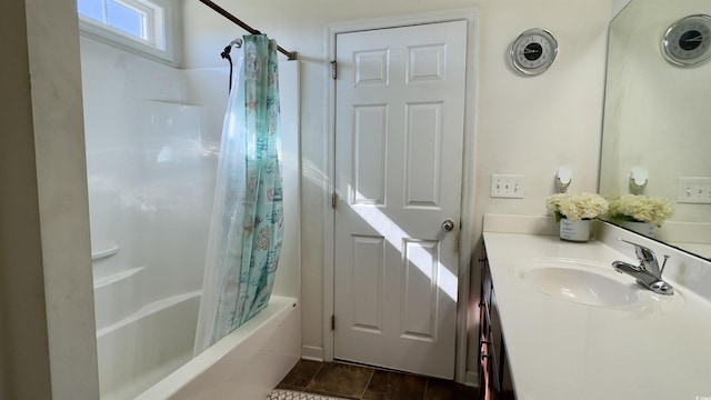 bathroom featuring vanity and shower / bathtub combination with curtain