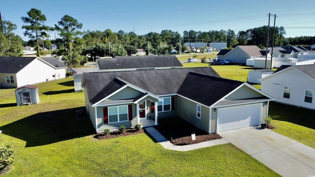 view of front of house with a front lawn and a garage