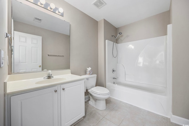 full bathroom featuring toilet, vanity, tile patterned flooring, and shower / washtub combination