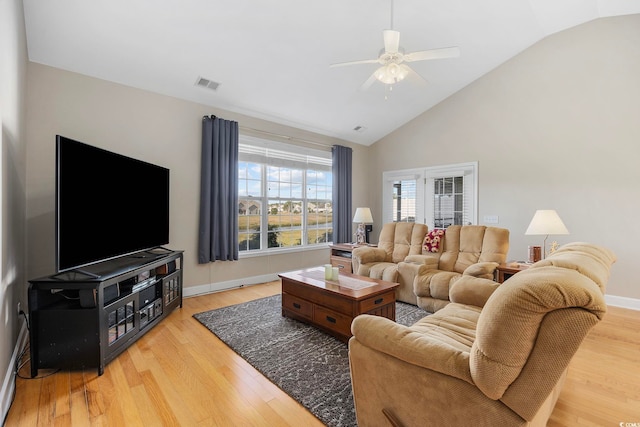 living room featuring wood-type flooring, ceiling fan, and lofted ceiling