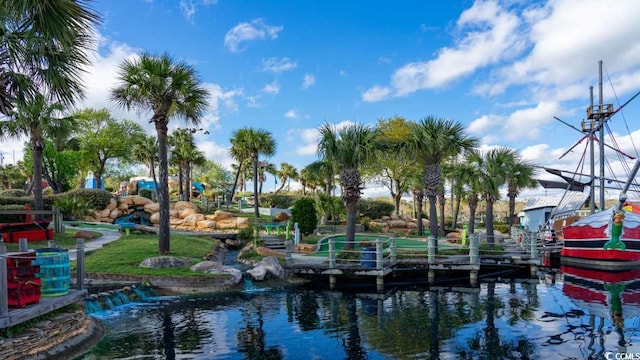 view of community with a dock