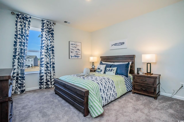 bedroom featuring light carpet