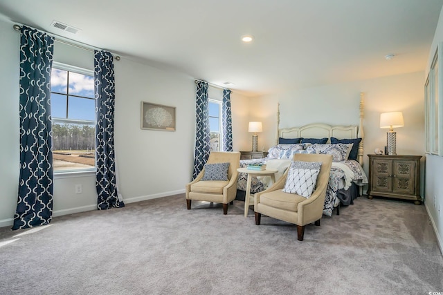 bedroom featuring light carpet