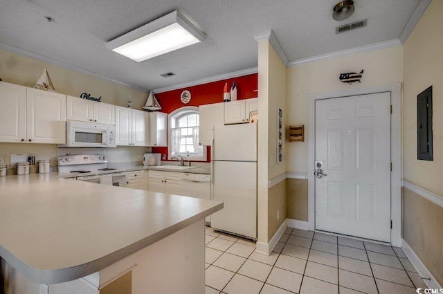 kitchen featuring kitchen peninsula, white cabinetry, white appliances, and ornamental molding