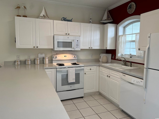 kitchen featuring ornamental molding, white appliances, sink, light tile patterned floors, and white cabinets