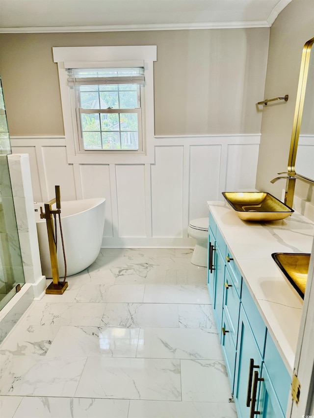 3936 Murrells Inlet Rd, Murrells Inlet, SC 29576 - bathroom featuring a decorative wall, double vanity, a freestanding tub, a wainscoted wall, and marble look tiles