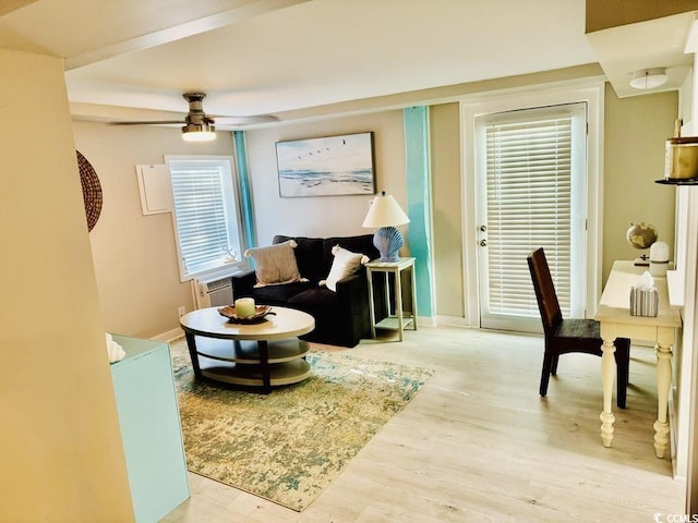 3936 Murrells Inlet Rd, Murrells Inlet, SC 29576 - living area featuring a ceiling fan, wood finished floors, and a wall unit AC
