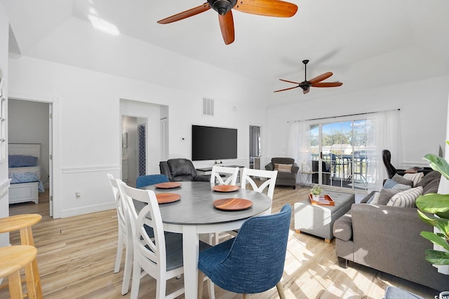 dining space with visible vents, light wood-style flooring, and a ceiling fan