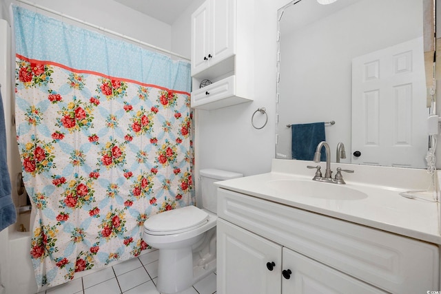 bathroom featuring toilet, shower / bath combination with curtain, vanity, and tile patterned flooring