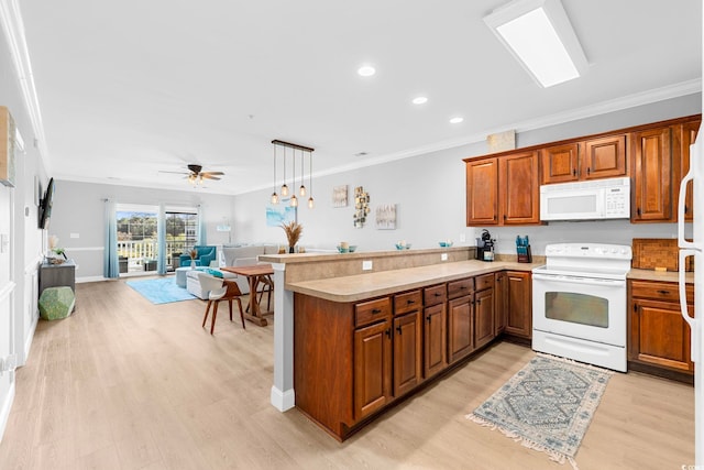 kitchen with light hardwood / wood-style flooring, hanging light fixtures, kitchen peninsula, white appliances, and ceiling fan