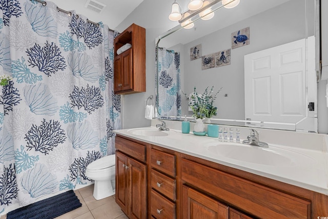 bathroom with vanity, curtained shower, toilet, and tile patterned floors