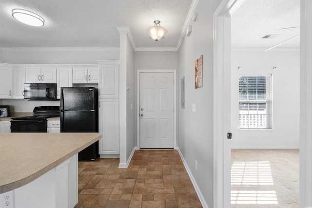 kitchen featuring crown molding, white cabinets, black appliances, and a textured ceiling