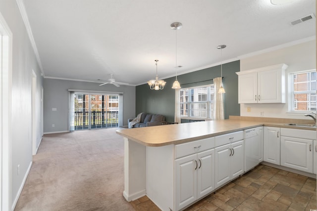 kitchen with kitchen peninsula, white cabinetry, white dishwasher, ornamental molding, and light colored carpet