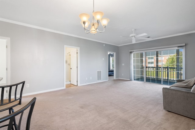 carpeted living room featuring crown molding and ceiling fan with notable chandelier