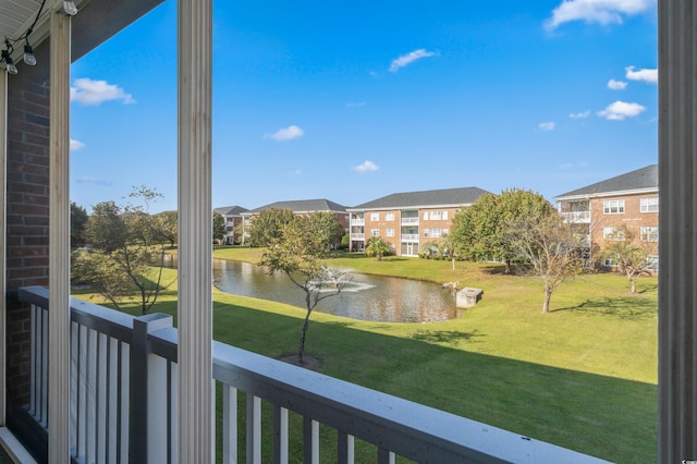 balcony featuring a water view