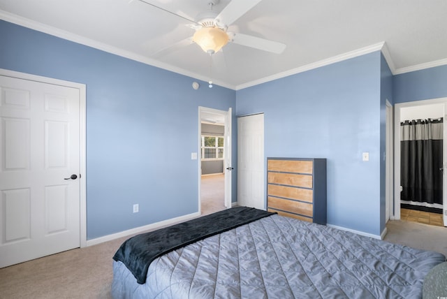 carpeted bedroom with ceiling fan and ornamental molding