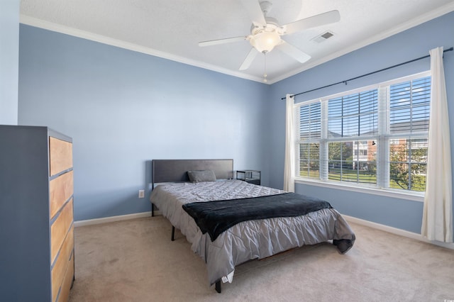 carpeted bedroom featuring ceiling fan and ornamental molding