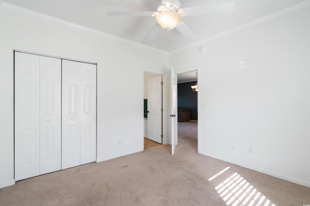 unfurnished bedroom with crown molding, light carpet, and ceiling fan with notable chandelier