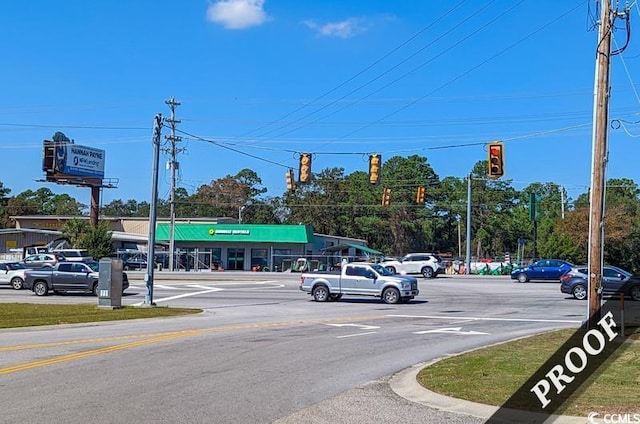 4220 Coquina Harbour Dr Unit B-11, Little River, SC 29566 - view of asphalt road with traffic lights