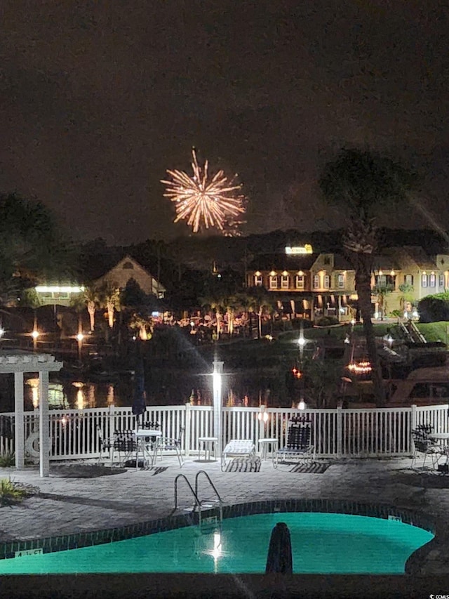 4220 Coquina Harbour Dr Unit B-11, Little River, SC 29566 - pool at night with a patio area and a community pool