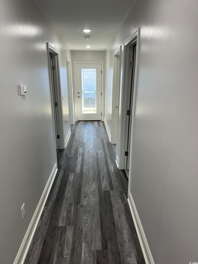 corridor featuring dark hardwood / wood-style flooring