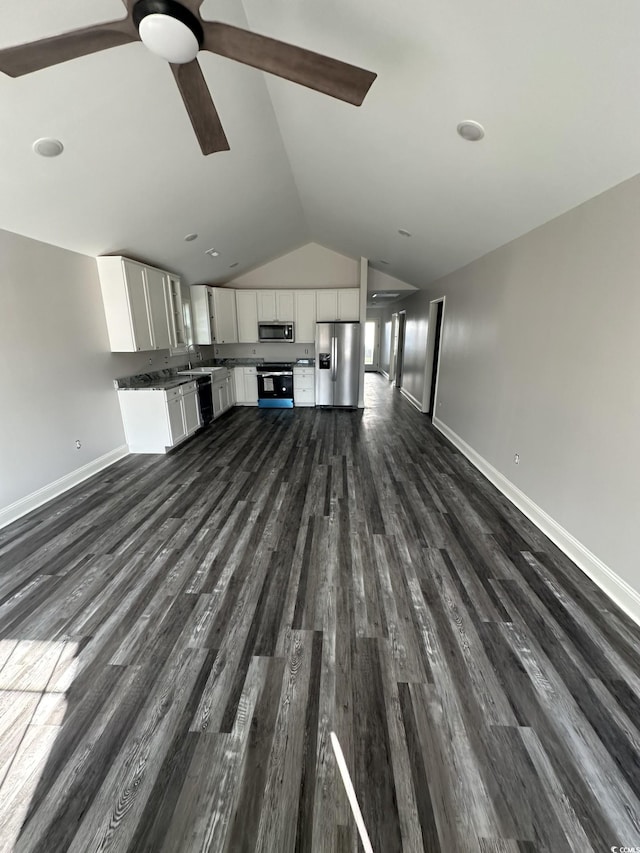 unfurnished living room with dark hardwood / wood-style flooring, ceiling fan, lofted ceiling, and sink