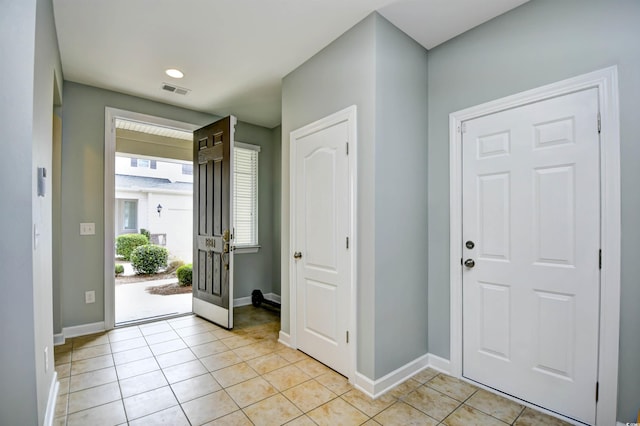 foyer with light tile patterned floors